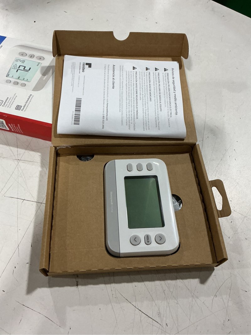 Condition photo showing As Is for honeywell home x2p heating and cooling push button programmable thermostat