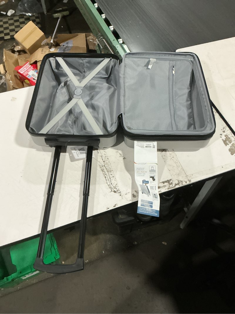 Condition photo showing Good Condition for protege vacationer 20-inch carry-on expandable hardside luggage with 360-spinner wheels and divider pockets, silver