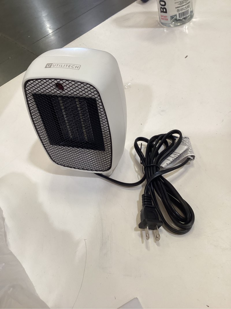 Condition photo showing As Is for utilitech 500 -watt ceramic compact personal indoor electric space heater