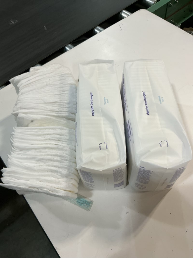Condition photo showing As Is for ( 3pack) Coterie Ultra Soft Diapers Newborn (Size- N)