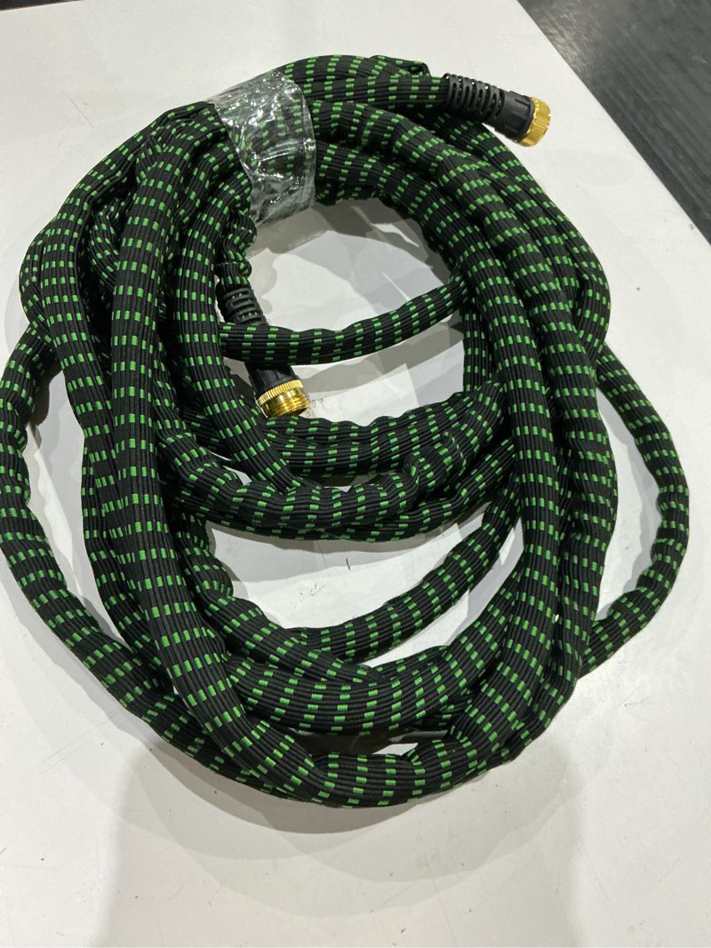 Condition photo showing As Is for unknown size. flex-able hose xtreme kink free woven green hose