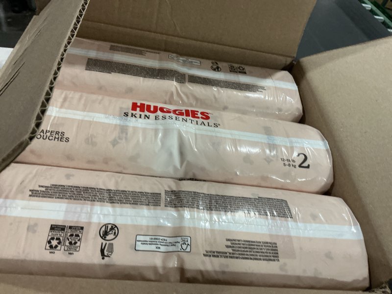 Condition photo showing New/Like New for Huggies Size 2 Diapers, Skin Essentials Baby Diapers, Size 2 (12-18 lbs), 192 Count (3 Packs of 64), Packaging May Vary Size 2 192