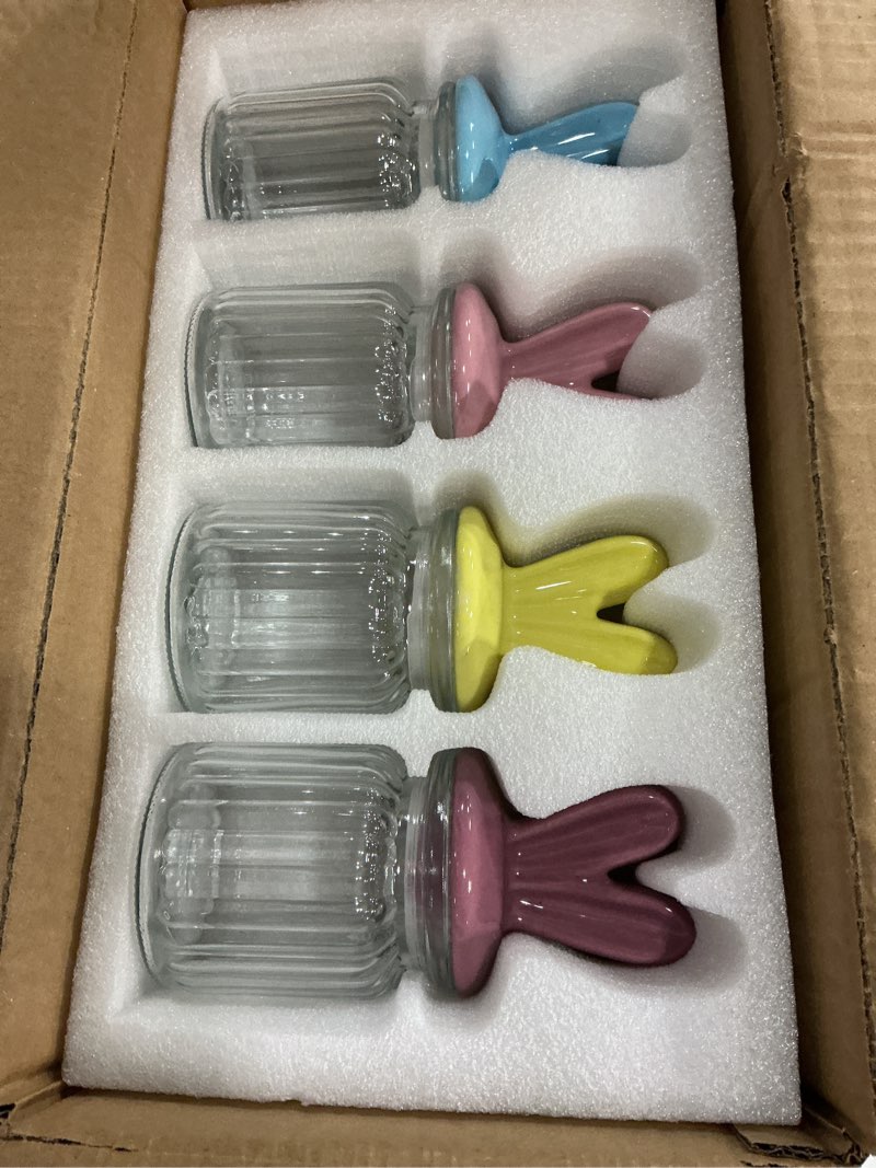 Condition photo showing New/Like New for easter decorations - 4 pack glass candy jars with ceramic bunny ear lids, easter bunny table decor for chocolate mini eggs sweets - 250ml pastel colored jars