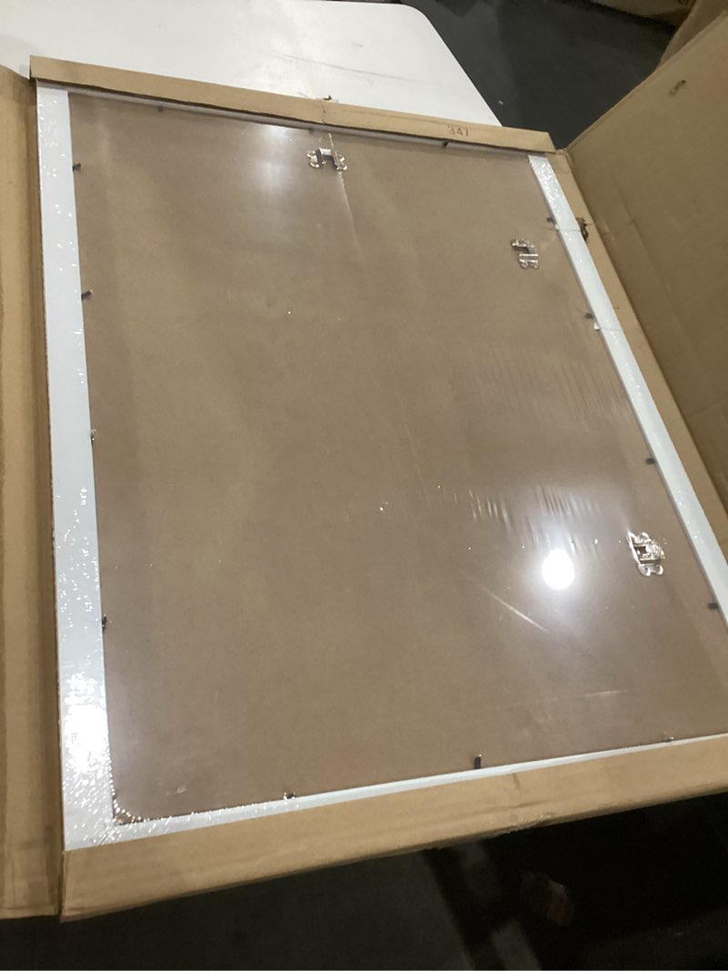 Condition photo showing As Is for LaVie Home 18 x 24 Poster Frame White, Display Pictures 16x20 with Mat or 18x24 Without Mat, Stable and Sturdy Picture Frame and Polished Plexiglass, Horizontal and Vertical Format of The Wall?1 Pack? 18x24 White