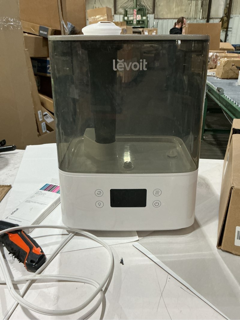 Condition photo showing As Is for humidifier