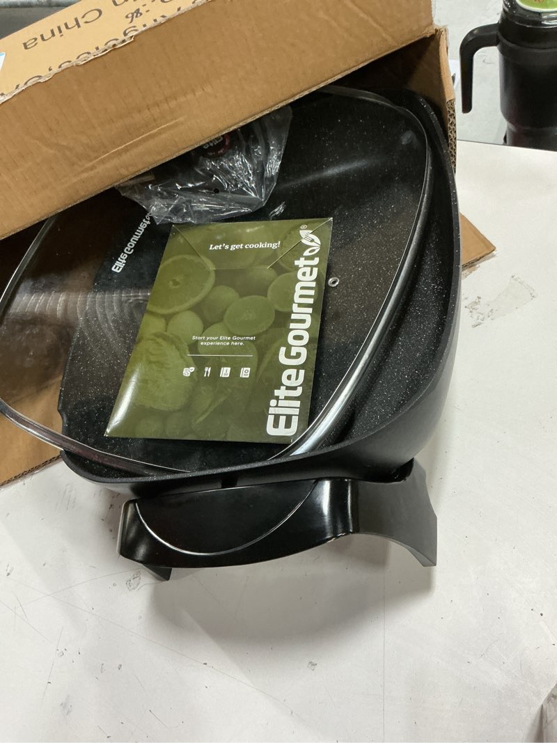 Condition photo showing As Is for Elite Gourmet EG-6203# Extra Deep 16"x13"x3.2" (10.5Qt.) Scratch Resistant, Easy Pour Spout Dishwasher Safe, Non-stick Electric Skillet with Glass Vented Lid, Adjustable Temperature, Black