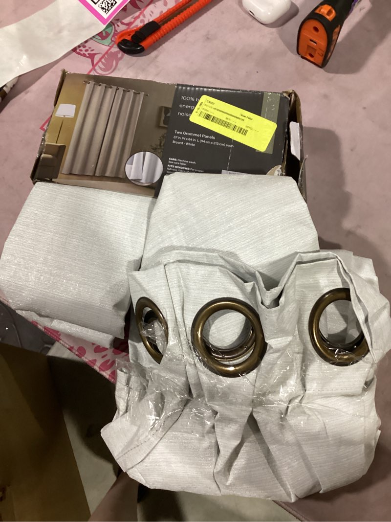 Condition photo showing As Is for sun zero bryant 2-piece textured thermal insulated 100% blackout grommet top curtain panel, white, 37”w x 63"l
