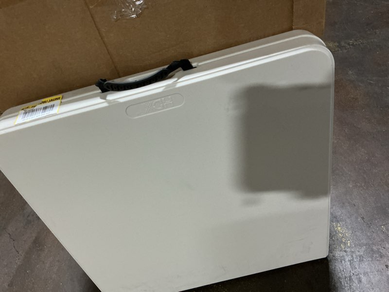 Condition photo showing Good Condition for hdx 4 ft. almond resin top single hand adjustable height indoor/outdoor rectangular folding utility table, seats 4