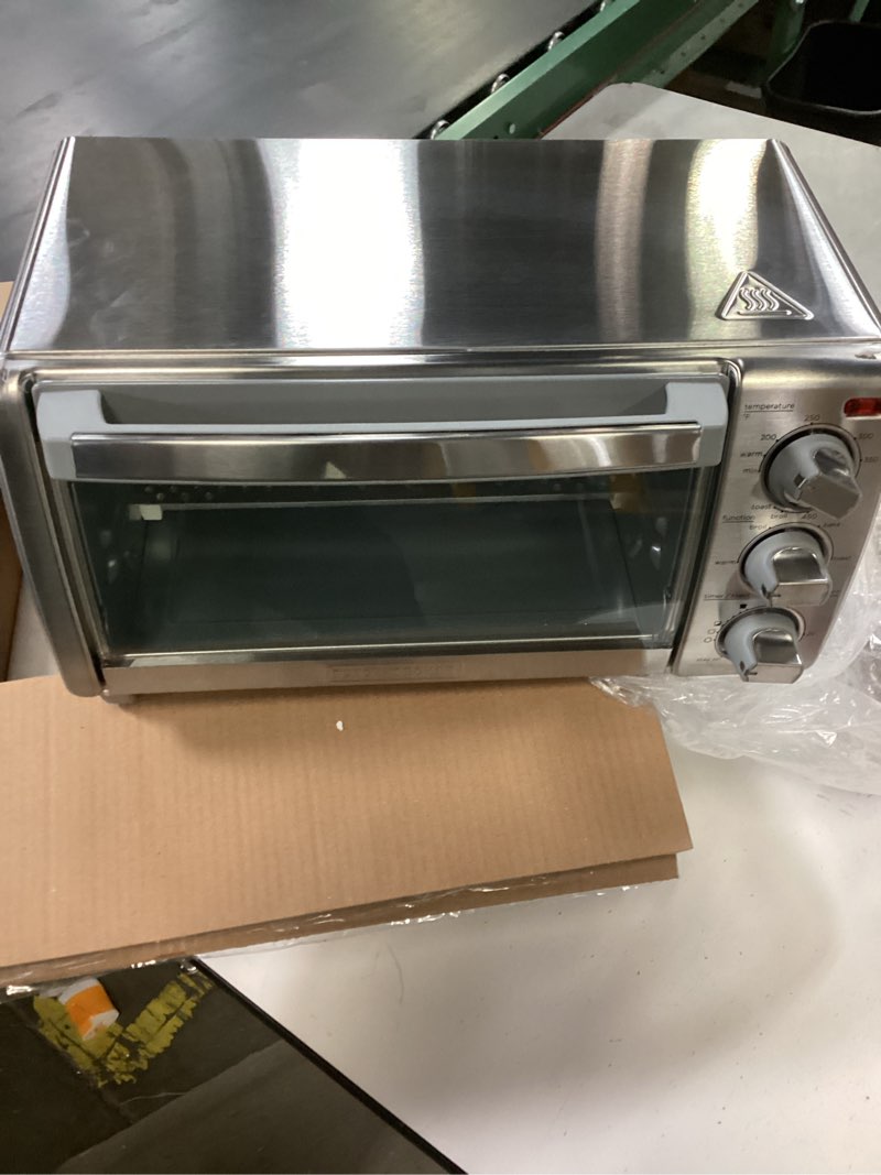 Condition photo showing As Is for BLACK+DECKER 4-Slice Toaster Oven, TO1745SSG-1A, Even Toast, 4 Cooking Functions Bake, Broil, Toast and Keep Warm, Removable Crumb Tray, Timer