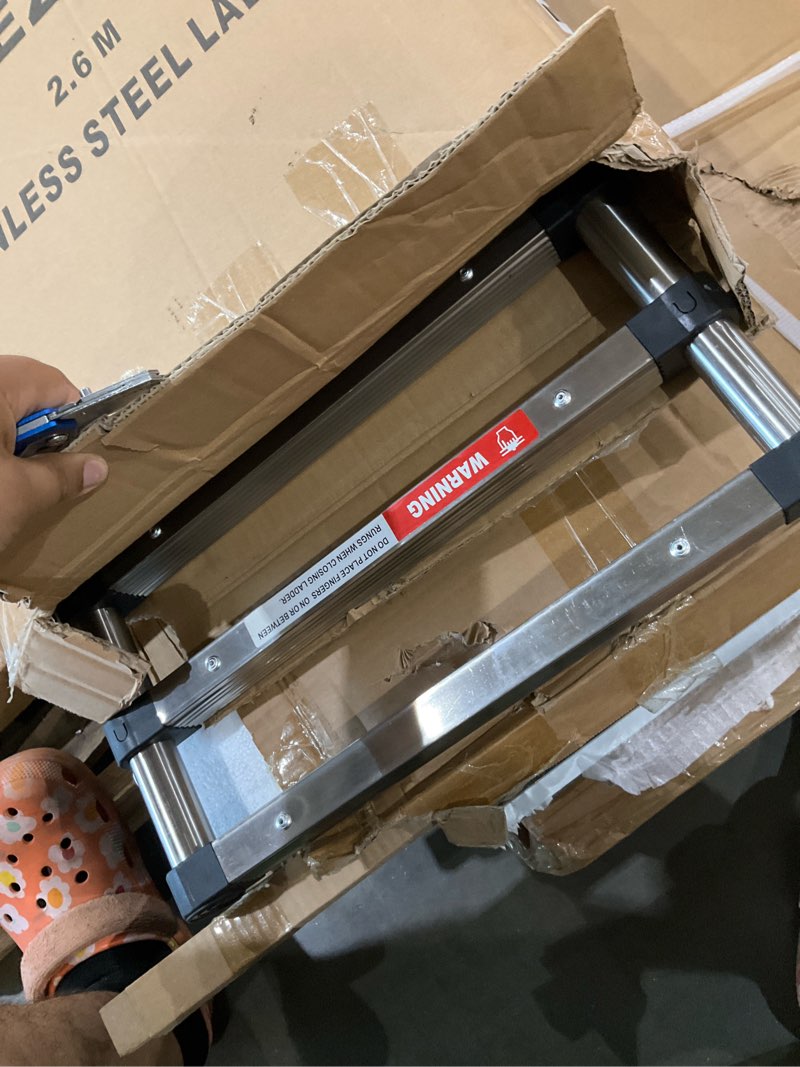 Condition photo showing As Is for dezex telescoping ladders 8.5 ft stainless steel ladder - one-button retraction telescopic ladder for home, rv, attic, loft, extension ladders with 2 triangle stabilizers, lasts 330 lbs silver 8.5 ft