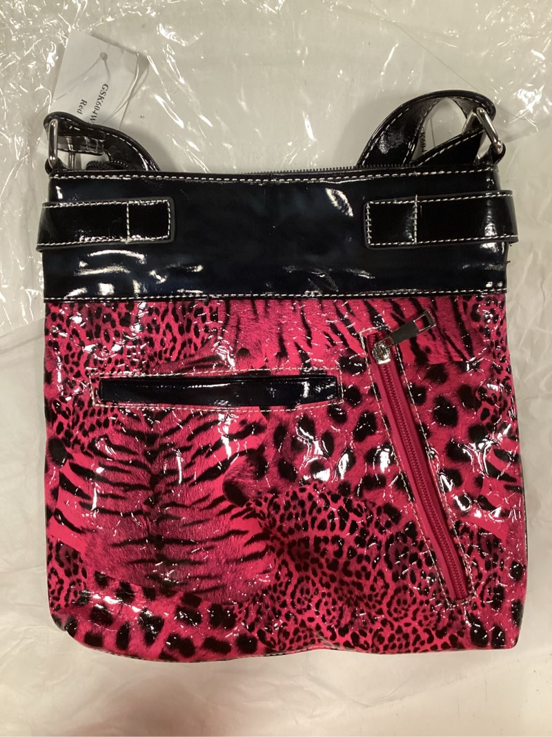 Condition photo showing New/Like New for pink skull rhinestone bag appears to be a brand like skull pirate or texas west, often featuring a leopard print background
