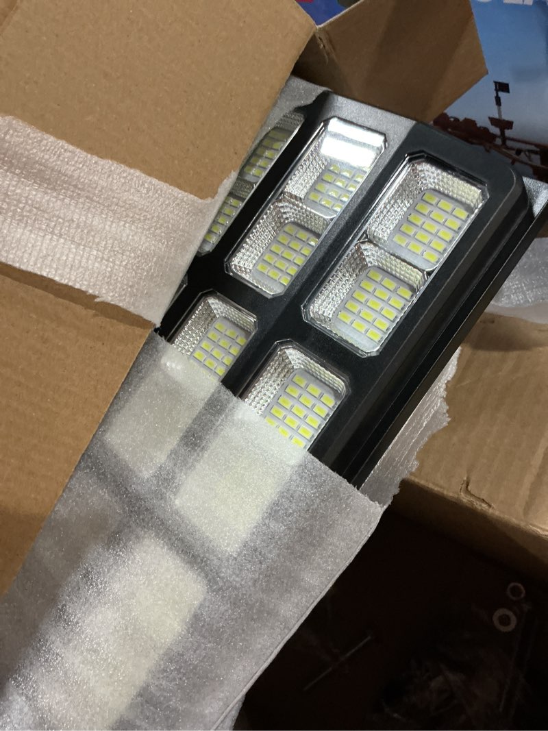 Condition photo showing New/Like New for Solar Street Lights Outdoor Waterproof Dusk to Dawn, Large 9000W Outdoor Floodlight LED Motion Sensor, 7000K Wide Angle Parking Lot Flood Lamp Remote Control for Yard Garden 9000W-2Pack Black