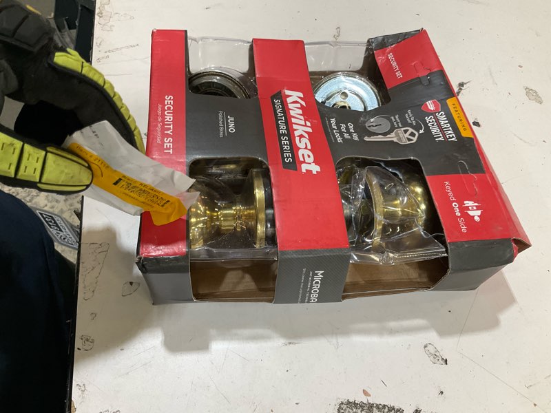 Condition photo showing As Is for kwikset smartkey juno polished brass deadbolt and entry door knob kw1 1-3/4 in.