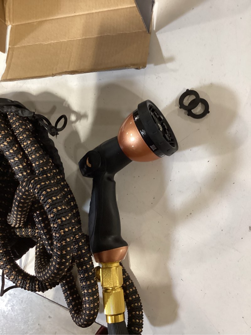 Condition photo showing Good Condition for garden hose 50ft, 2026 ultra lightweight water hoses w/10 function spray nozzle and 3/4" brass fittings- durable, & flexible water pipe for yard, lawn, outdoor & gardening(black rose gold) 50ft black rose gold
