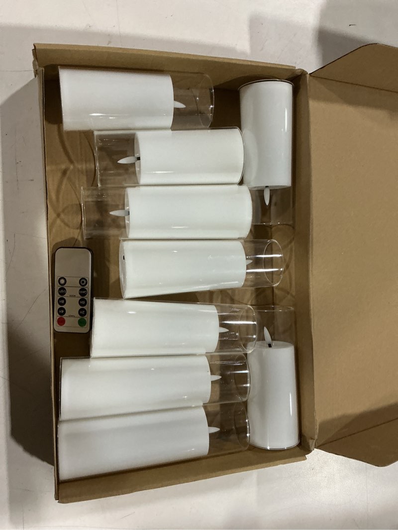 Condition photo showing Good Condition for kakoya flickering flameless candles battery operated with remote and 2/4/6/8 h timer acrylic led pillar candles pack of 9 (appr d2.3"xh5.5"6.5"7.5")with realistic 3d wick candles for home decor(white) white-1