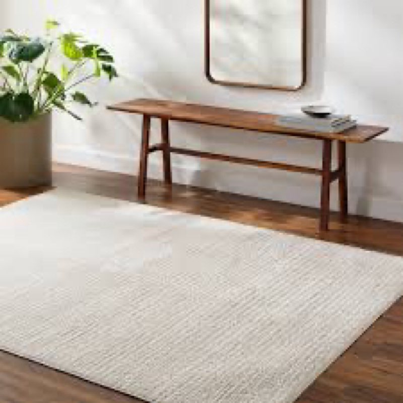 arny solid color machine woven polyester area rug in cream