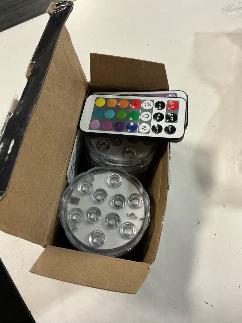 Condition photo showing Good Condition for submersible led lights with remote, 16 colors 4 modes battery powered color changing led pumpkin lights for halloween pumpkin camping bucket décor (4 packs)