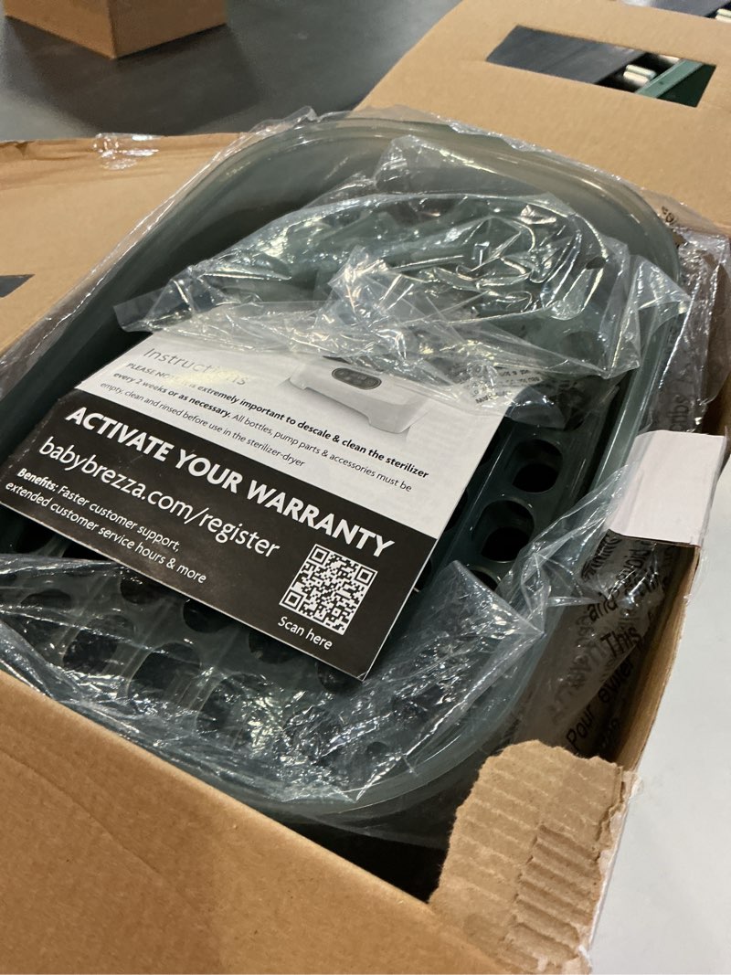 Condition photo showing As Is for Baby Brezza Bottle Sterilizer and Dryer Advanced – 33% Faster - Largest Capacity Steam Sanitizer - Universal Sterilization Machine for All Bottles + Pump Parts - HEPA Air Filter White