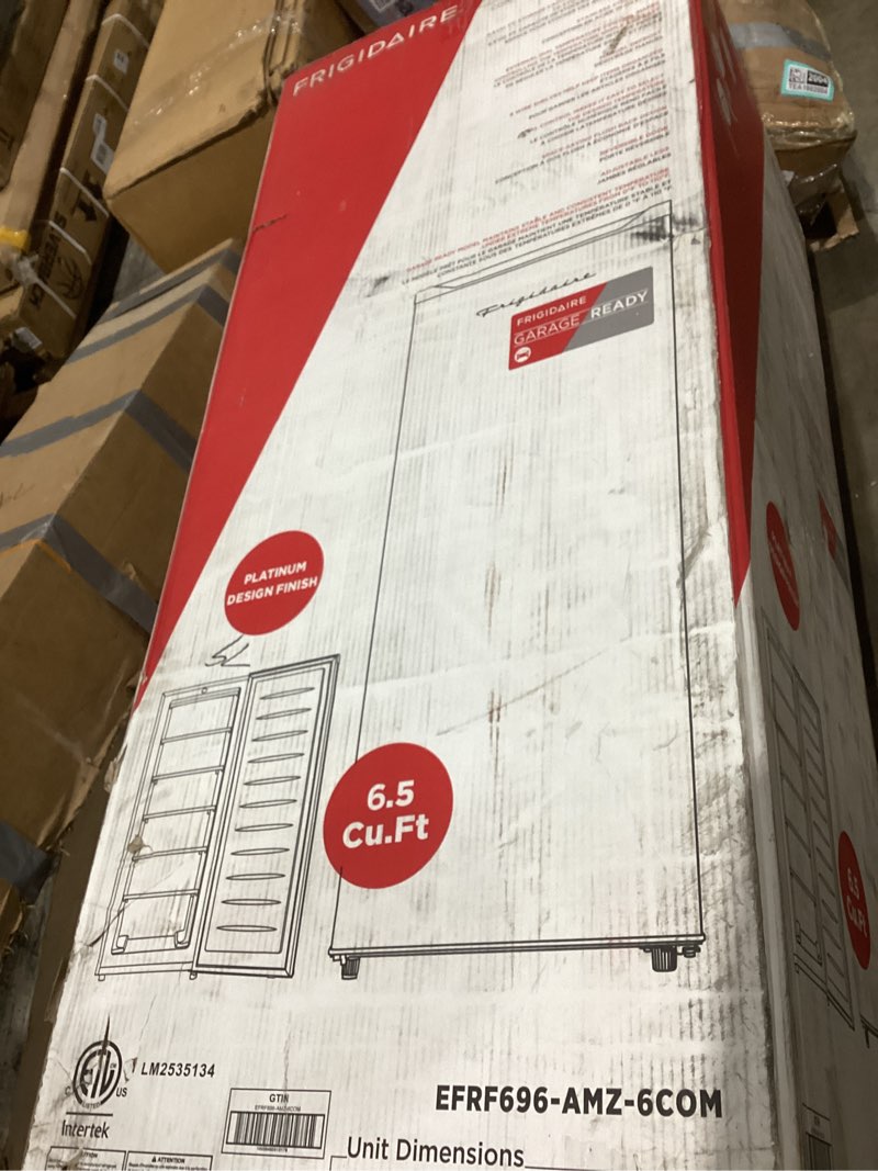 Condition photo showing As Is for Frigidaire Upright Freezer, 6.5 cu. ft., Deep Freeze, Vinyl Coated Metal with Wire Shelving, Compact for Kitchen, RV, Dorm, Cabin, and Trailer, Platinum Design Series, Silver - 21D x 23W x 56H 6.5 cu ft