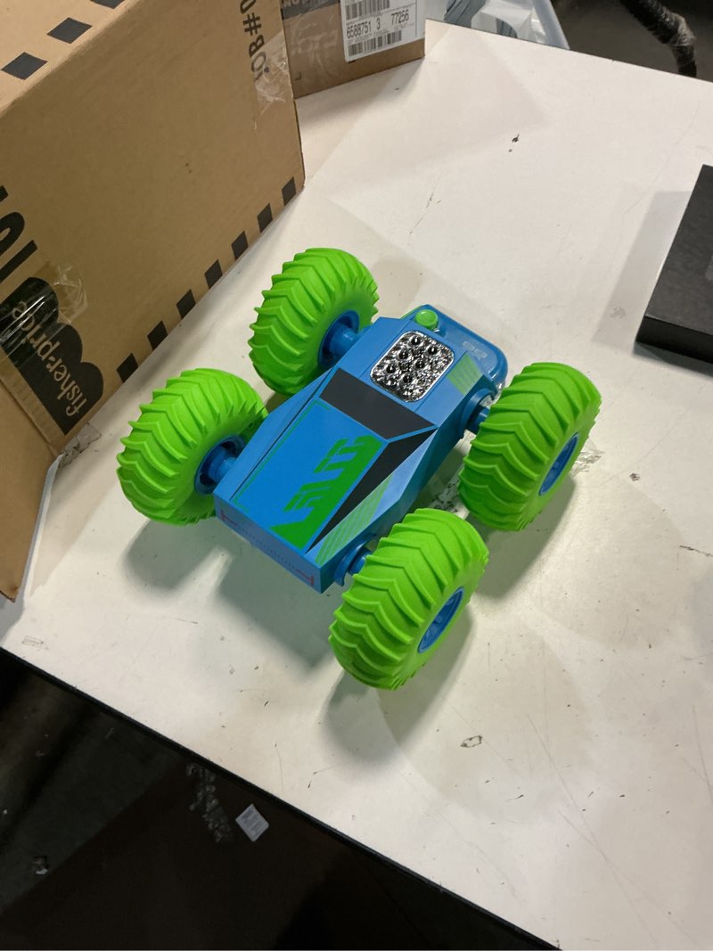 Condition photo showing As Is for sharper image® bounce blitz remote control stunt car, green, ages 6+
