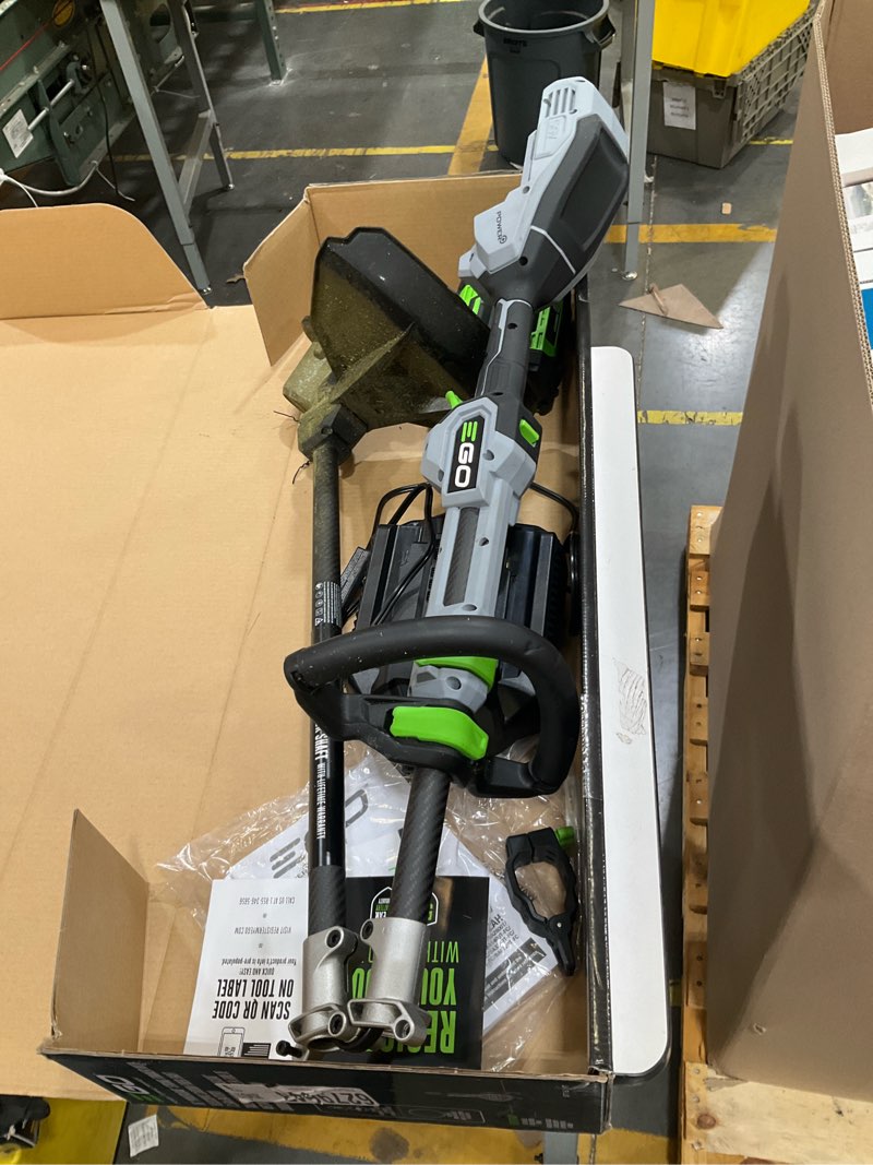 Condition photo showing As Is for ego battery string trimmer kit (battery & charger)
