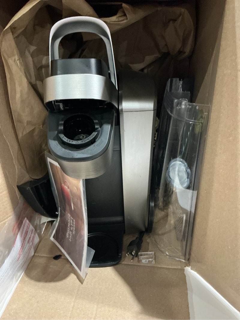 Condition photo showing As Is for keurig k-elite single serve k-cup pod coffee maker, with strength and temperature control, iced coffee capability, 8 to 12oz brew size, programmable, brushed silver