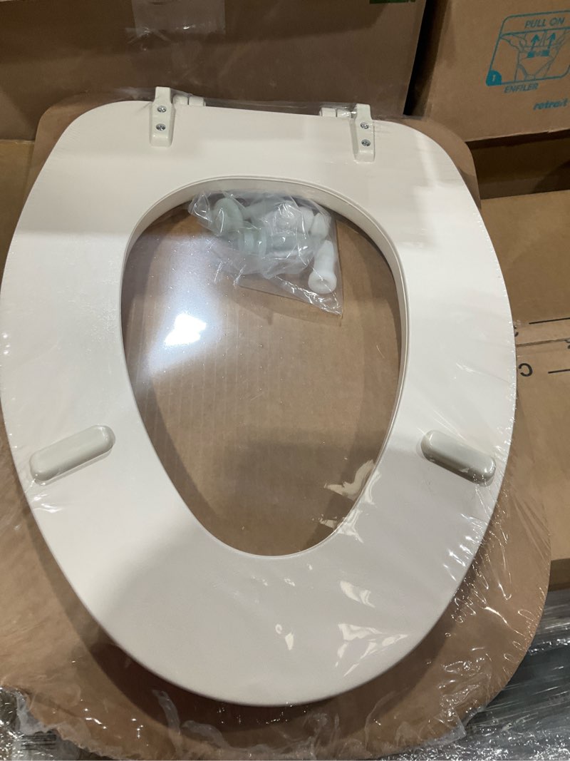 Condition photo showing New/Like New for Mayfair Padded Toilet Seat, Cushioned Soft Vinyl over Wood Core Seat, Secure Hinges, Easy Clean, Made in USA, Elongated, Bone Round Bone Toilet Seat