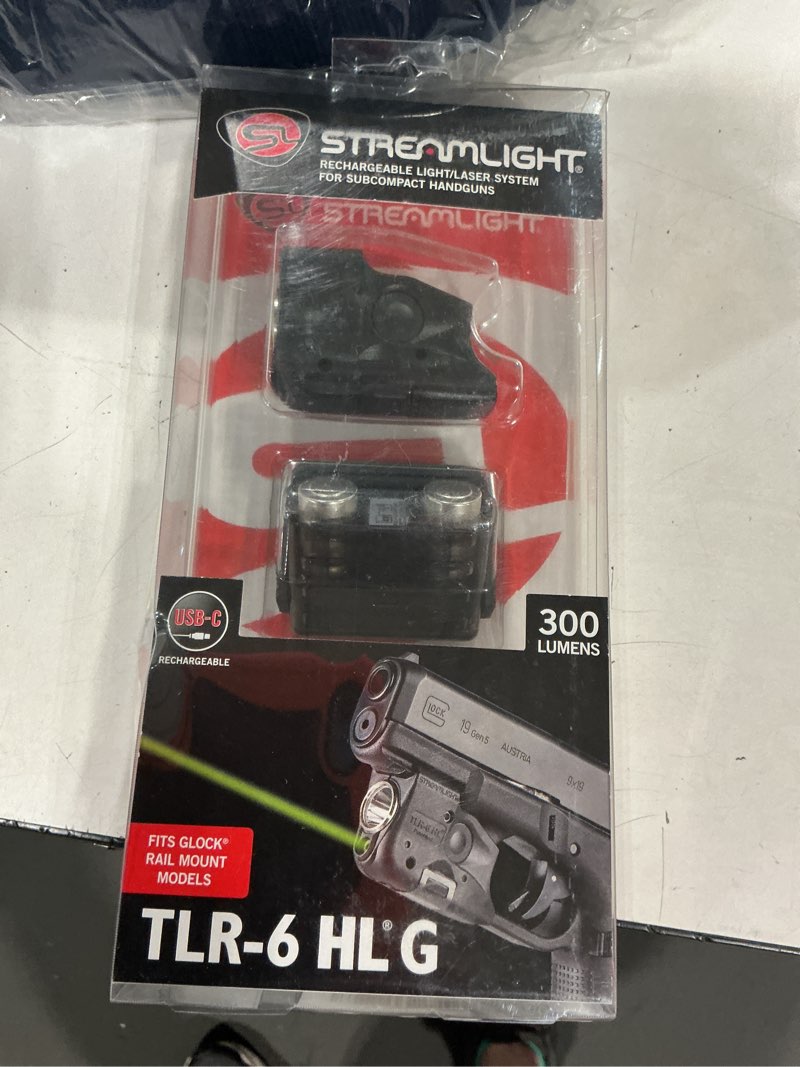 Condition photo showing Good Condition for lumen tactical weapon light with integrated red aiming laser designed exclusively and solely for select glock railed handguns, black glock gen 3 17/19/21/22/30/31 gen 4 17/19/20/21/22/23/29/35 black