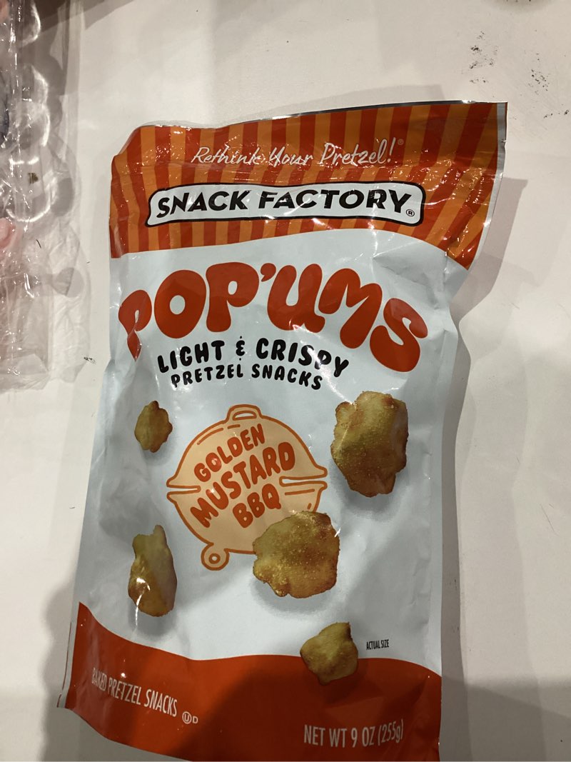 Condition photo showing New/Like New for (Best by feb 7 2026)Snack Factory Pop'ums Golden Mustard BBQ Pretzel Snacks, 9 Oz Bag (Pack of 2) Golden Mustard BBQ 9 Ounce (Pack of 2)