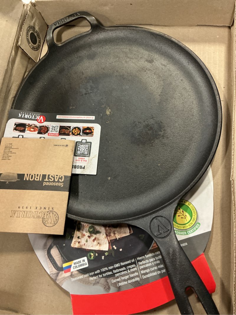 Condition photo showing As Is for Victoria 12-Inch Cast Iron Comal Pizza Pan with a Long Handle and a Loop Handle, Preseasoned with Flaxseed Oil, Made in Colombia 12 Inch Pizza Pan