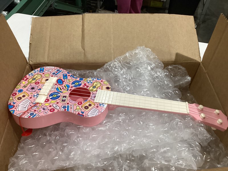 Condition photo showing Good Condition for LeeQee 21in Colorful Graffiti Ukulele Guitar for Kids, 4 Strings Kids Guitar Ukulele Musical Instruments Learning Educational Toys with Picks for 3 4 5 6 7 8 9 10 11 12 Toddler Boys Girls (Pink)