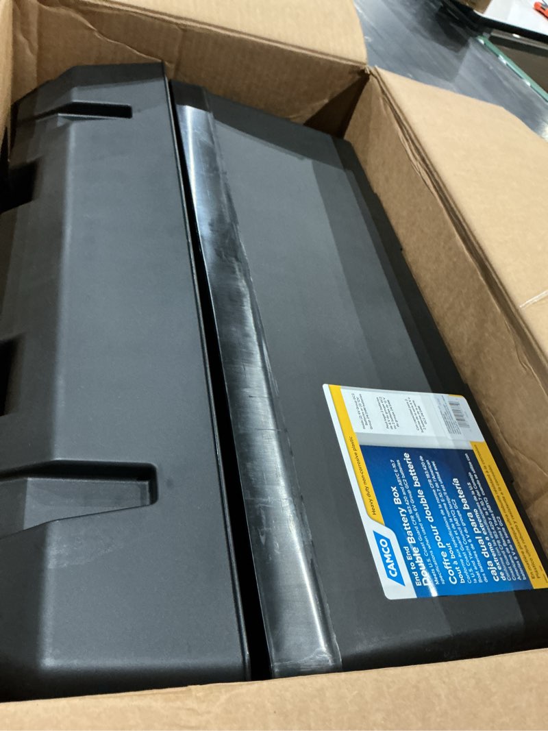 Condition photo showing As Is for camco double battery box - safely stores rv, automotive, and marine batteries - features a heavy-duty corrosion-resilient polymer construction and measures inside 21-1/2" x 7-3/8" x 11-3/16" (55375) frustration free packaging double battery box