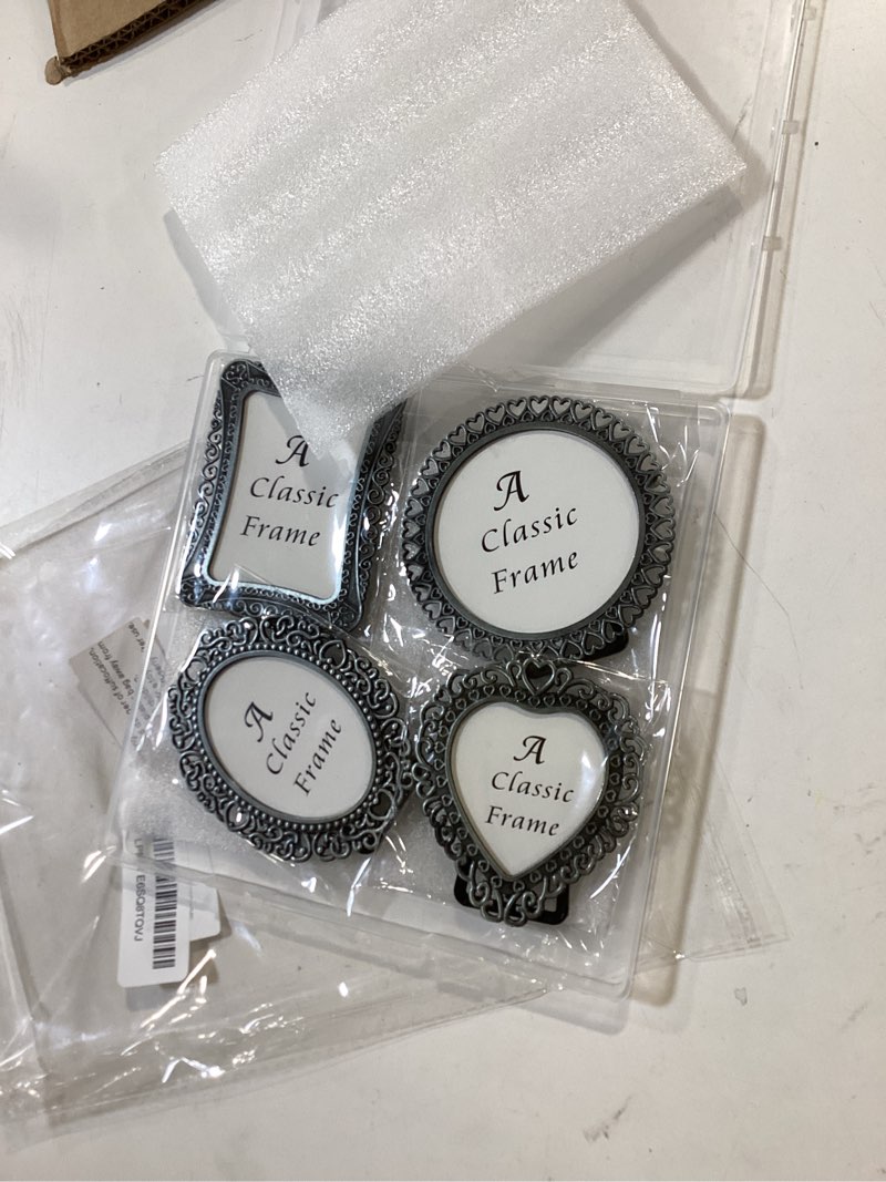 Condition photo showing New/Like New for set of 4 2x3inch retro mini metal picture frame, 4pcs vintage small 2x3 inch assorted shapes picture frame in oval heart round rectangle (retro silver)