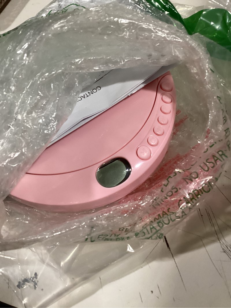 Condition photo showing Good Condition for cd player portable with 60 second anti skip, stereo earbuds, includes aux in cable and ac usb power cable for use at home or in car. pink pink_cd