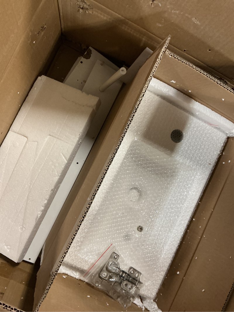 Condition photo showing As Is for 18.6" bathroom vanity with ceramic sink, freestanding cabinets with open shelf and toilet paper holder, left or right door orientation, white