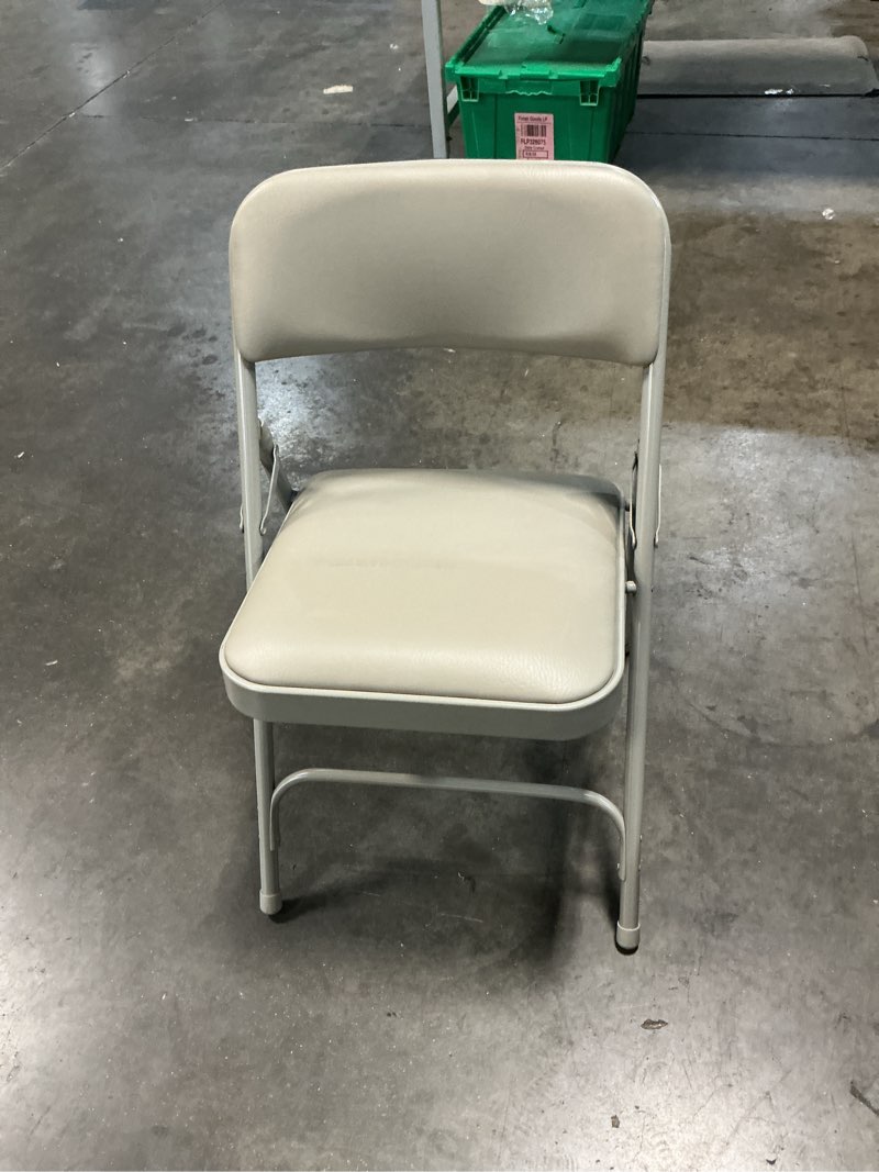 Condition photo showing Good Condition for nps 1200 series 29.5\" vinyl upholstered folding chair in warm gray (pack 1 )