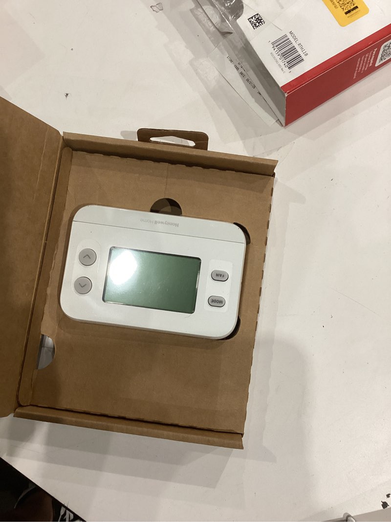 Condition photo showing As Is for honeywell home programmable thermostat single-stage heating