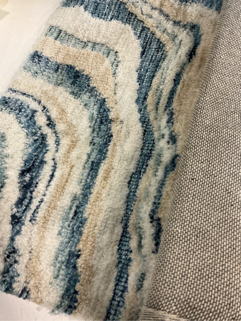 Condition photo showing As Is for allen + roth coastal tides 1-1/2 x 2-1/2 blue indoor geometric area rug
