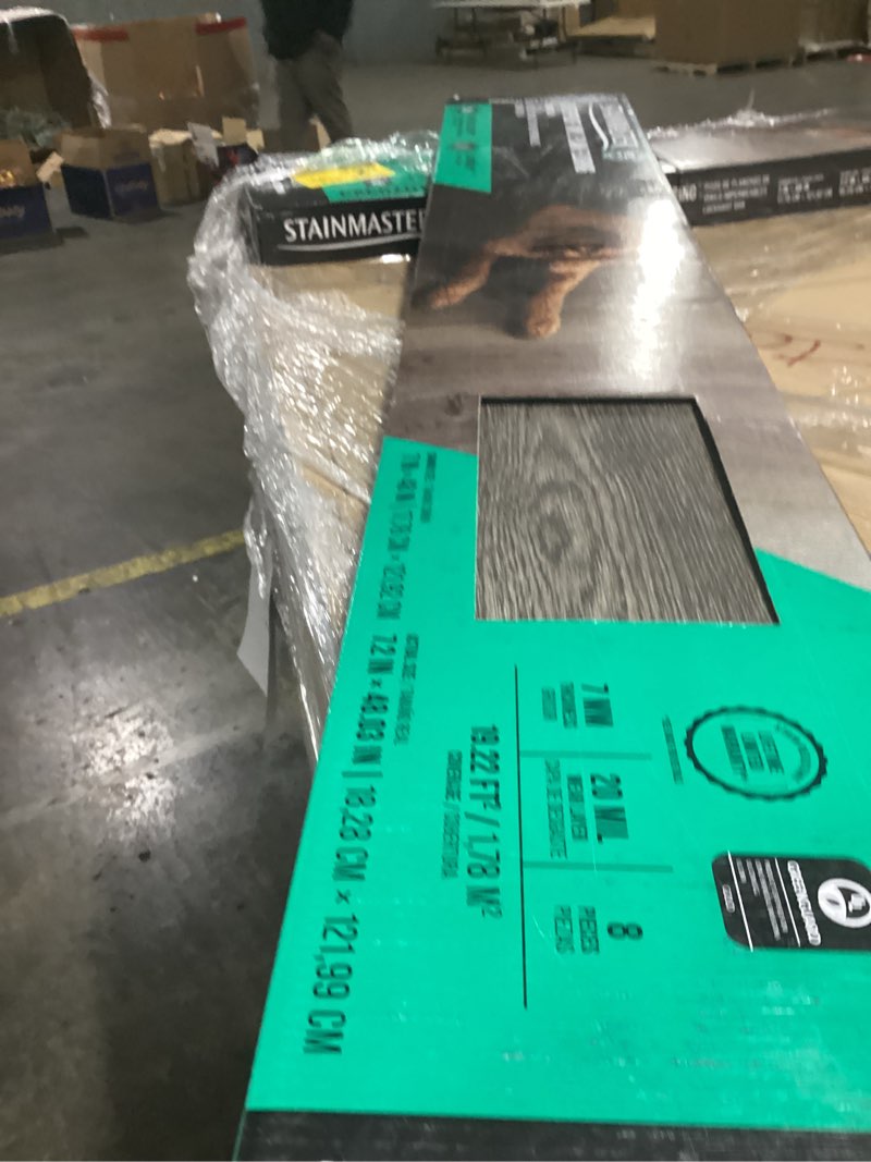 Condition photo showing New/Like New for STAINMASTER PetProtect Obsidian Brown 20-mil x 7-in W x 48-in L Waterproof Luxury Vinyl Plank