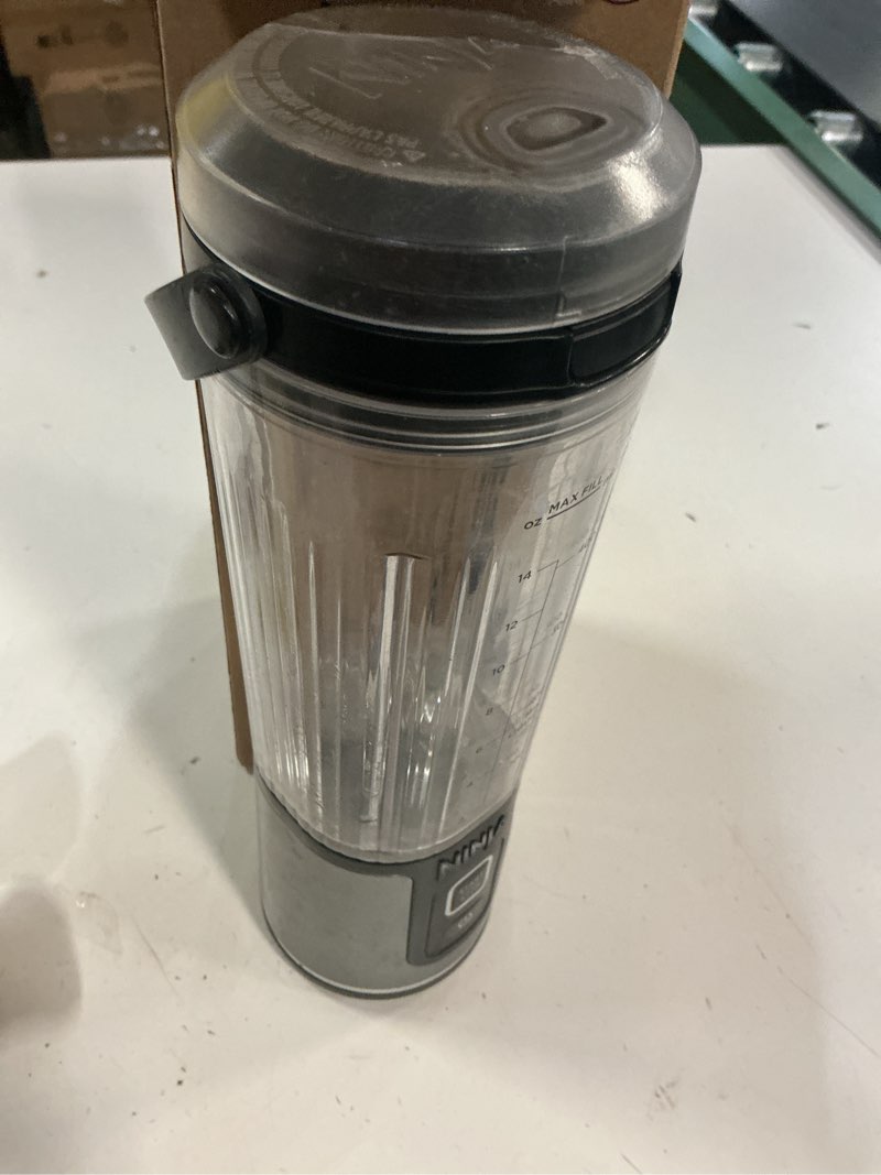 Condition photo showing As Is for ninja blast portable blender, cordless, 18oz. vessel, personal blender for-shakes and smoothies, bpa free, leakproof-lid and sip spout, usb-c rechargeable, dishwasher safe, metallic black, bc151mb