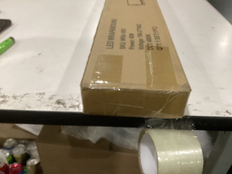 Condition photo showing New/Like New for hykolity 4FT LED Wraparound Light, 40W, 4400lm, 4000K, [2-lamp 32W Fluorescent Equiv.], 4 Foot LED Wrap Light Fixture, Flush Mount Office Ceiling Light for Garage, Office, Kitchen, ETL Listed 4000K - 40W 4FT 40W