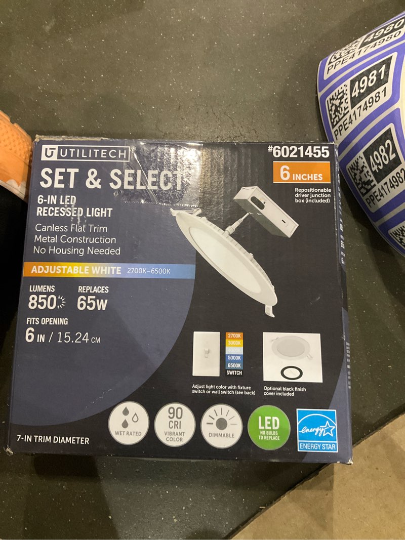 Condition photo showing As Is for utilitech set select white/ black 6-in 850 -lumens switchable white round dimmable light