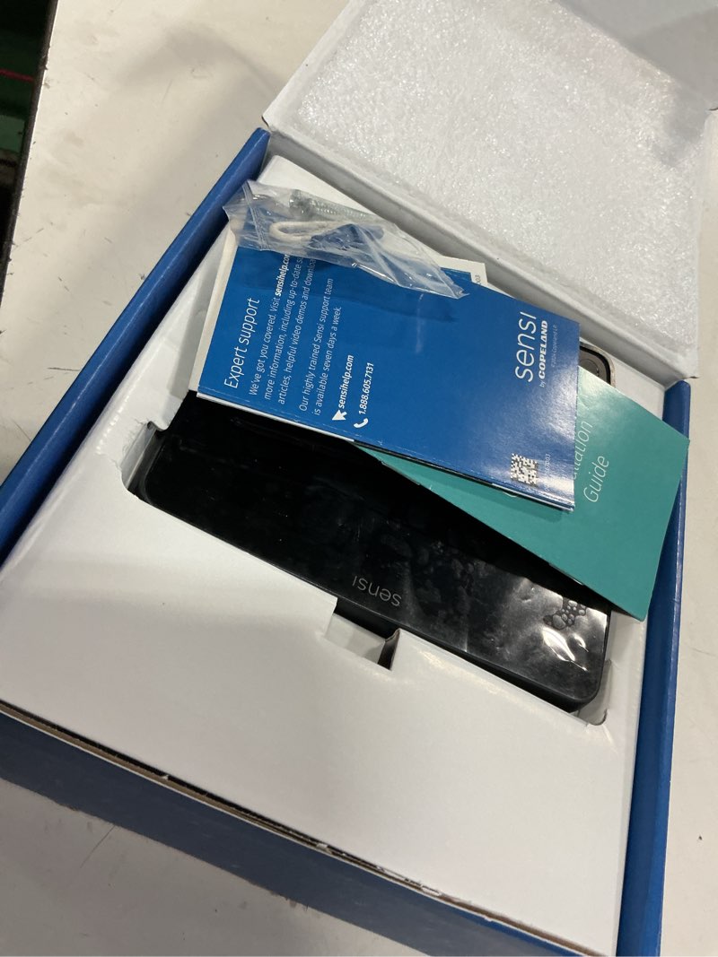 Condition photo showing As Is for sensi touch 2 smart thermostat with touchscreen color display, 100 years of expertise, programmable, wi-fi, data privacy, easy diy, works with alexa, energy star certified, st76, c-wire required black beveled edge thermostat