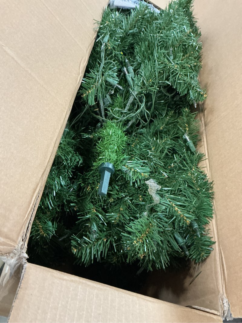 Condition photo showing As Is for National Tree Company 6 ft Pre-Lit Artificial Christmas Tree, Kincaid Spruce, 400 Clear Lights, 700 Tips, Includes Stand, green 6ft Tree