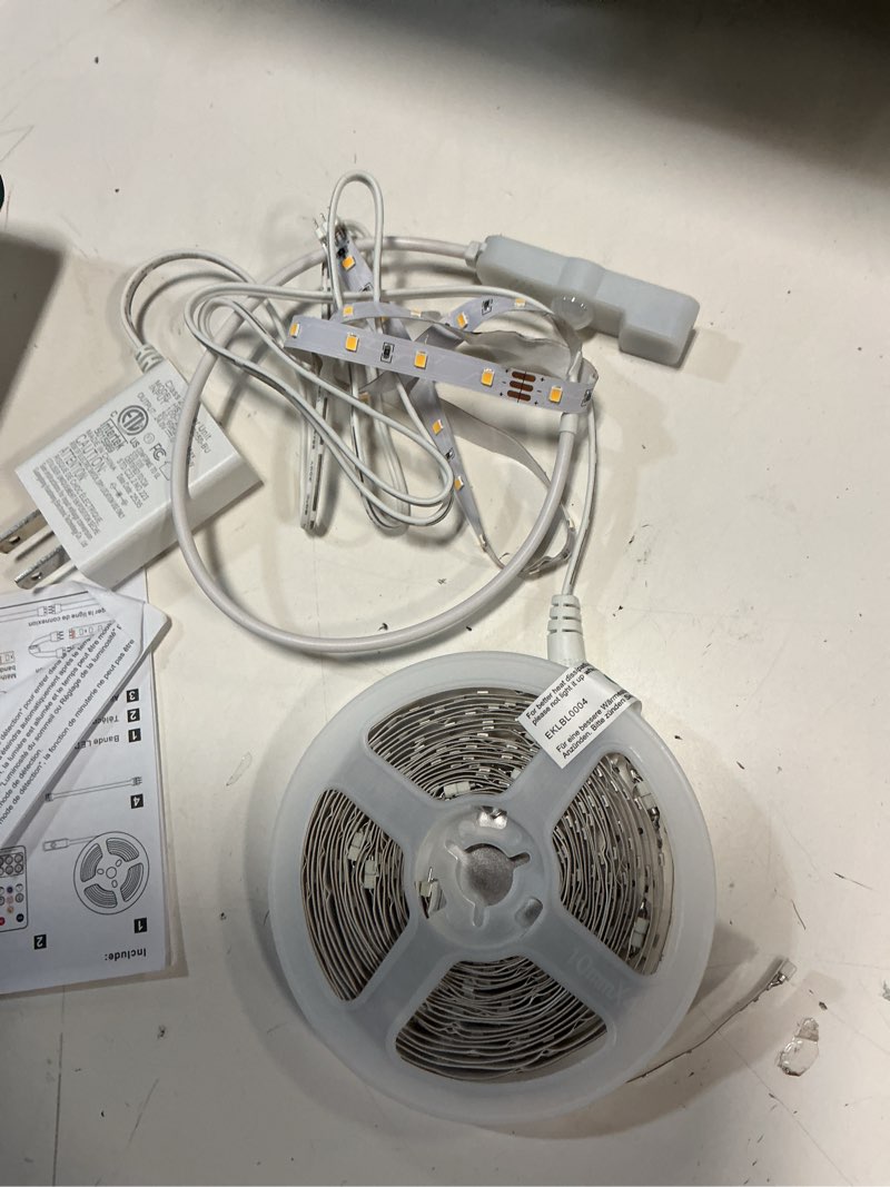 Condition photo showing As Is for lafulit 10 pcs under cabinet lights kit, stick on lights, flexible led strip lights with remote and power adapter, for kitchen cabinets shelf desk counter