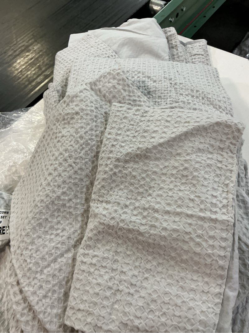 Condition photo showing As Is for organic luxe honeycomb duvet cover set, color: light grey, size: full/queen