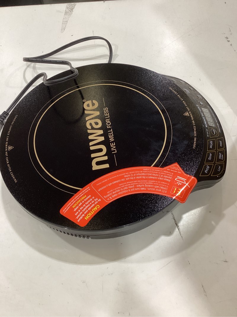 Condition photo showing As Is for nuwave precision induction cooktop gold, 12” shatter-resistant ceramic glass surface, large 8” heating coil, portable, 96 temp settings 100°f to 575°f, 3 wattage settings 700, 900, and 1500 watts