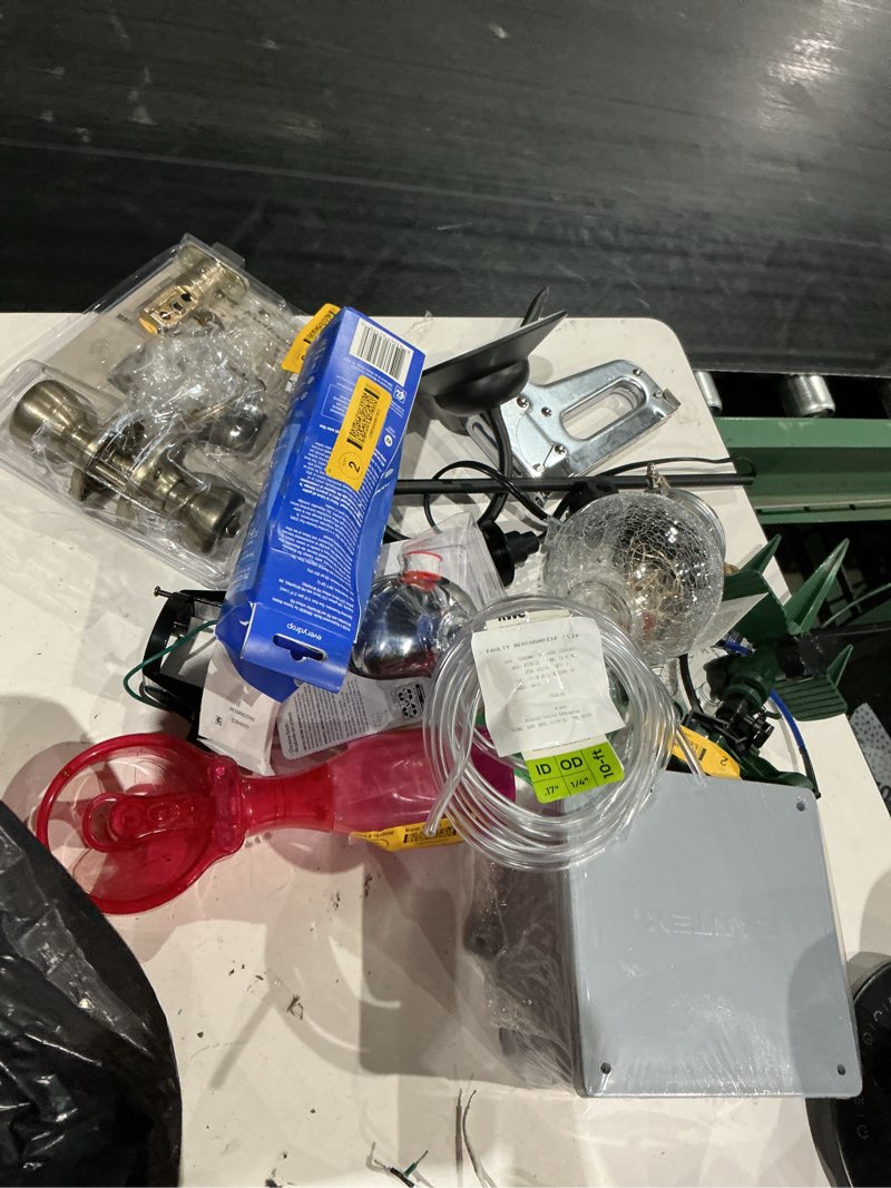 Condition photo showing As Is for assorted home improvement lot (small tools, screw, home accessories, etc.)