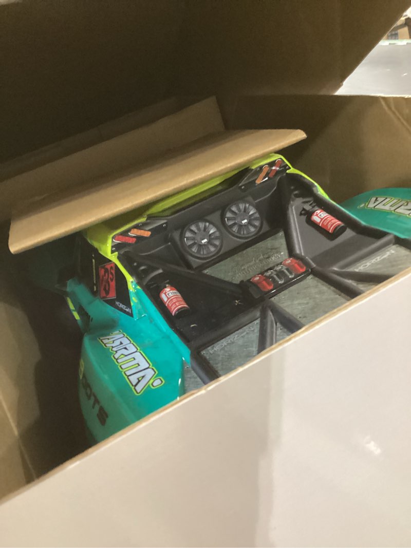 Condition photo showing As Is for arrma rc truck 1/10 fury 2wd 223s blx brushless short course truck rtr (battery and charger not included) with dsc, green, ara3521t2