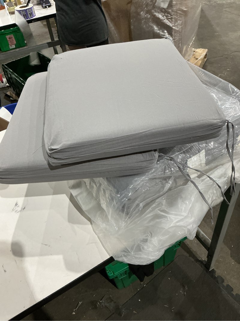 Condition photo showing As Is for stone grey leala high back outdoor dining chair cushion